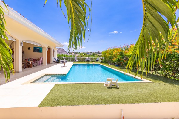 Blue Bay - Luxury, tropical home with pool and golf course views