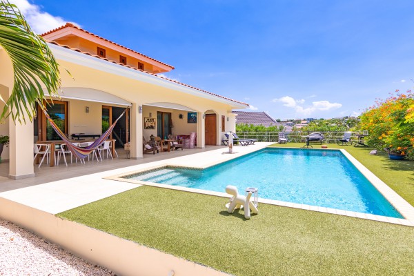 Blue Bay - Luxury, tropical home with pool and golf course views