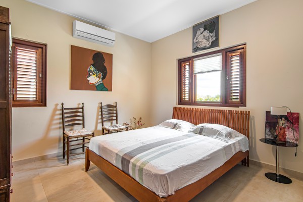 Blue Bay - Luxury, tropical home with pool and golf course views