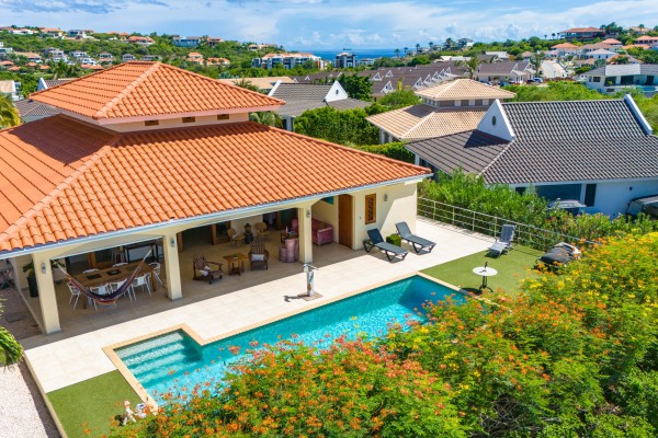 Blue Bay - Luxury, tropical home with pool and golf course views